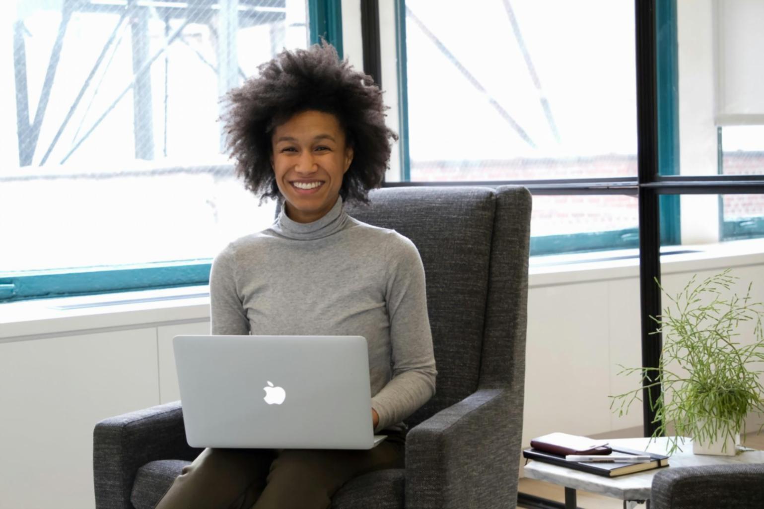 Modern office workspace with multiple monitors displaying financial dashboards and budget analysis charts
