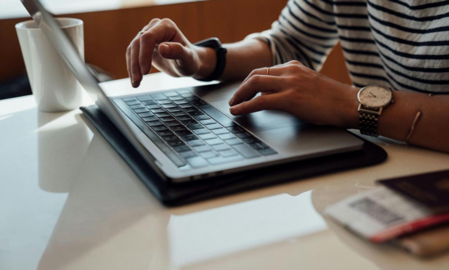 Professional analyzing budget spreadsheets with multiple financial reports and calculators